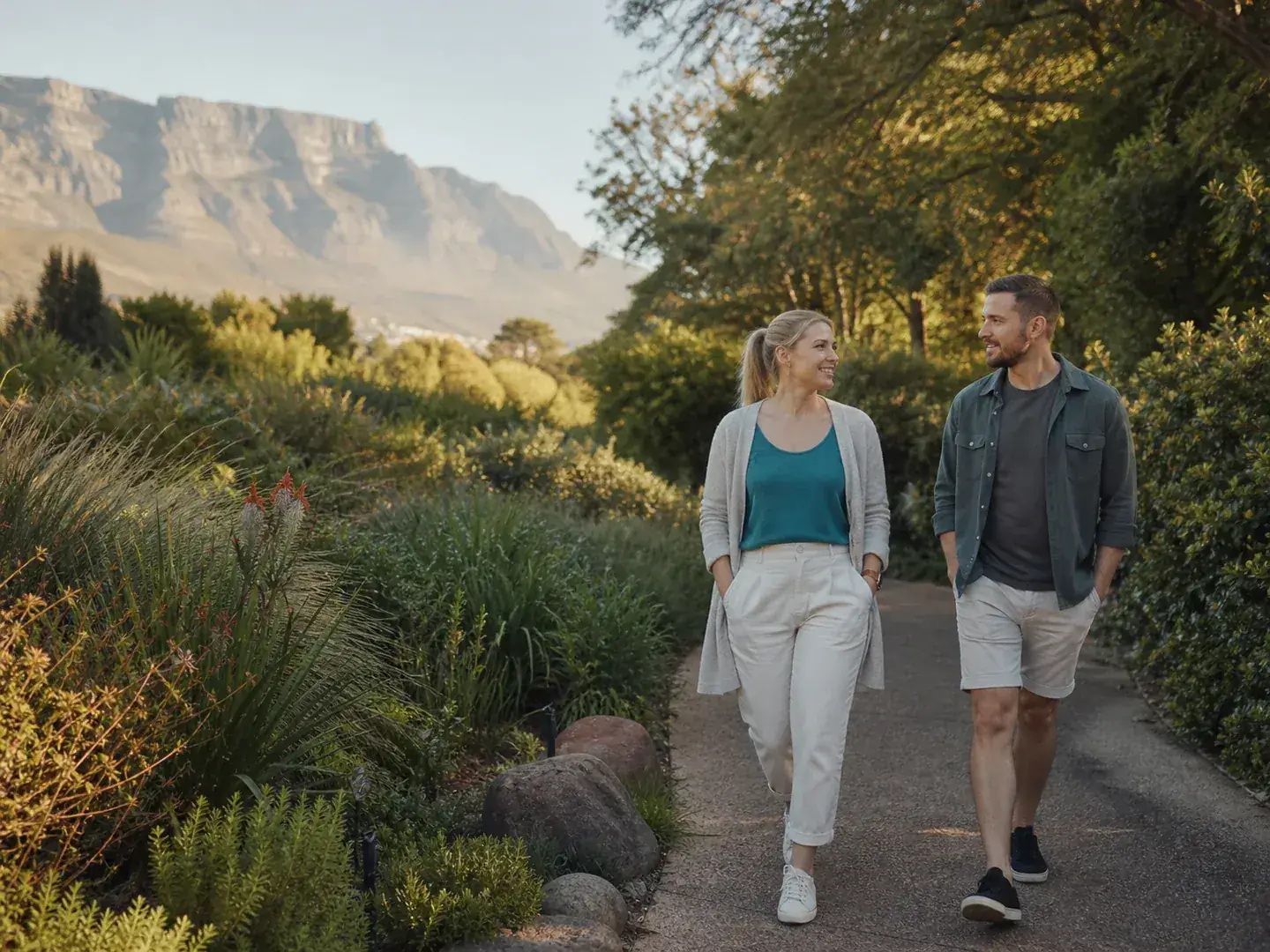 Two adults walking together in a Cape Town garden